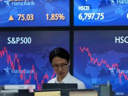 Los únicos sectores que amanecían en rojo eran el tecnológico, el sanitario y el de bienes esenciales. AP/L. Jin-man