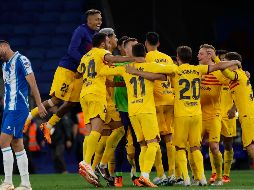 En su primera temporada completa en el banquillo, Xavi conquistó su primer título en España. AP/Joan Monfort