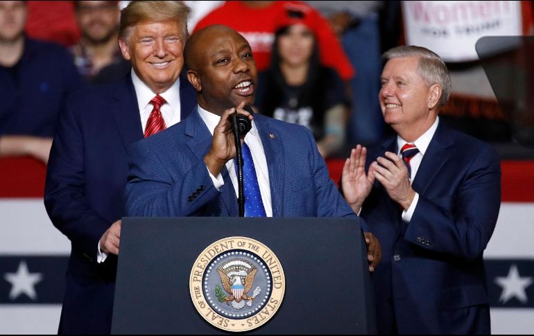 Donald Trump, Lindsey Graham y Tim Scott. AP