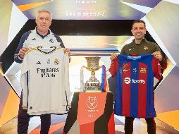 Carlo Ancelotti y Xavi Hernández durante la conferencia de prensa previo al cotejo de hoy. EFE/RFE