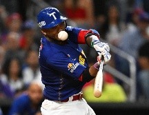 Alcides Escobar inició el camino a la victoria con un elevado de sacrificio. AFP/C. Khanna