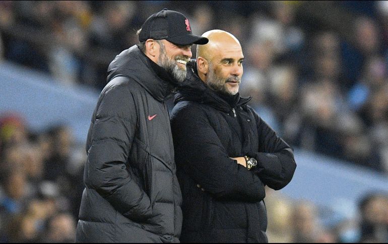 Jurgen Klopp y Pep Guardiola se han visto las caras como entrenadores en 29 ocasiones. AFP/O. Scarff