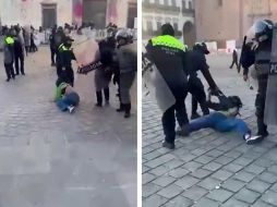 Cinco elementos agarran por la fuerza a una joven, quien se resistía a ser detenida, pero en el forcejeo, queda sin su playera y es arrastrada. ESPECIAL