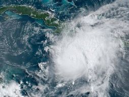 A su paso traerá rachas de viento y fuertes lluvias, esperando que toque tierras mexicanas con categoría 1 o 2. AFP