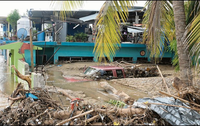 Colonias y cosechas siguen inundadas, a una semana de la llegada de John. AFP