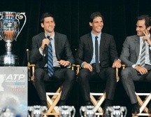 Nadal (centro) marcó toda una época con sus duelos ante Novak Djokovic y Roger Federer. Entre los tres suman 66 títulos de Grand Slam. AFP/D. Dipasupil