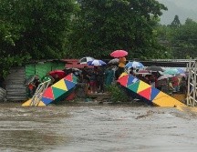 Las lluvias continuas cayeron durante la noche y siguieron hasta esta mañana en la ciudad de San Pedro Sula, sitio donde ayer jugó la Selección Mexicana contra la local. AP / M. Castillo