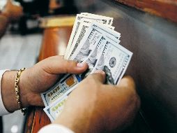 La divisa nacional podría llegar al tipo de cambio de 21 pesos por dólar en 2026, de acuerdo con especialistas. EL INFORMADOR/ Archivo