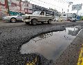 Para reportar baches o socavones en Guadalajara y Zapopan, pueden llamar al número de GuaZap: 33-3610-1010. EL INFORMADOR/ H. Figueroa.