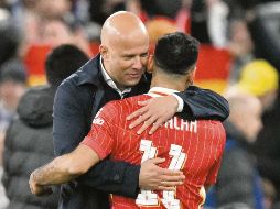 Arne Slot y Mo Salah se han distanciado en los últimos días. AFP/O. Scarff