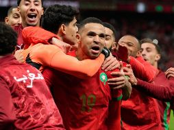 Los jugadores de Marruecos festejando la victoria que los regreso a instancias finales 22 años después. AP/M. Elshamy