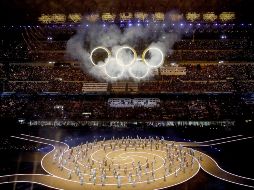 La noche en que el invierno se vistió de gala, la llama olímpica reclamó su trono en territorio italiano. EFE / M. Balti