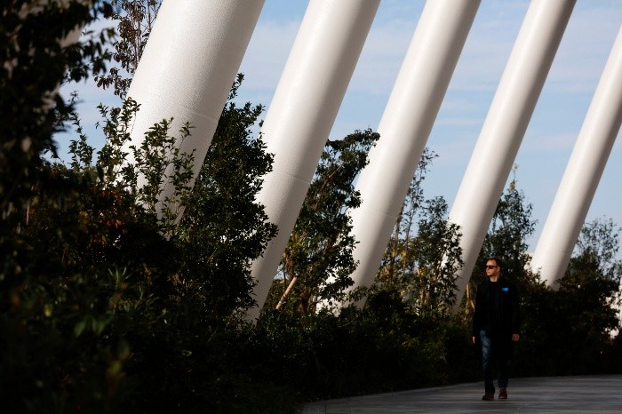 A man walks along a walkway called 